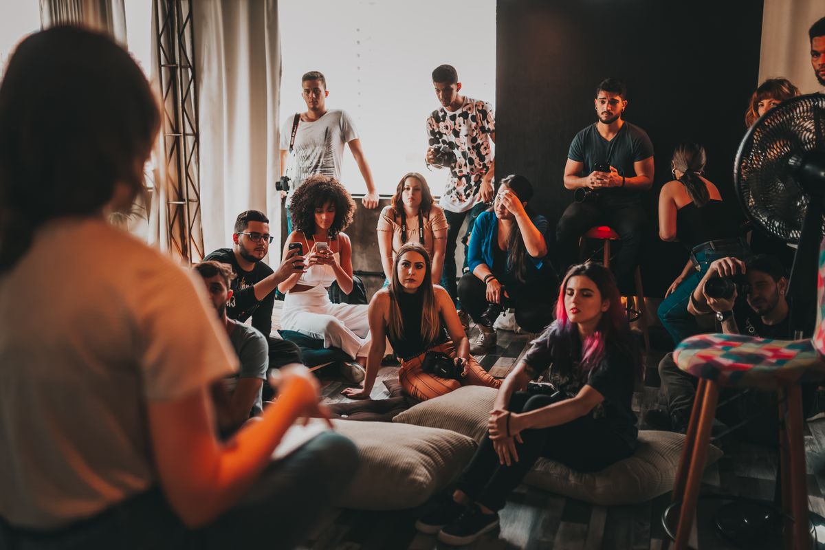 A facilitator speaking with a group in a workshop